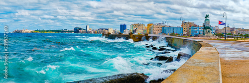 The Havana skyline and the iconic Malecon seawall with a stormy ocean © kmiragaya