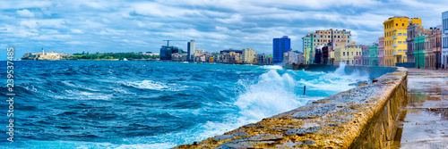 The Havana skyline and the iconic Malecon seawall with a stormy ocean © kmiragaya