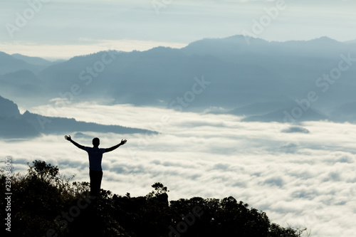 Obraz na płótnie Silhouette of people standing on the mountain