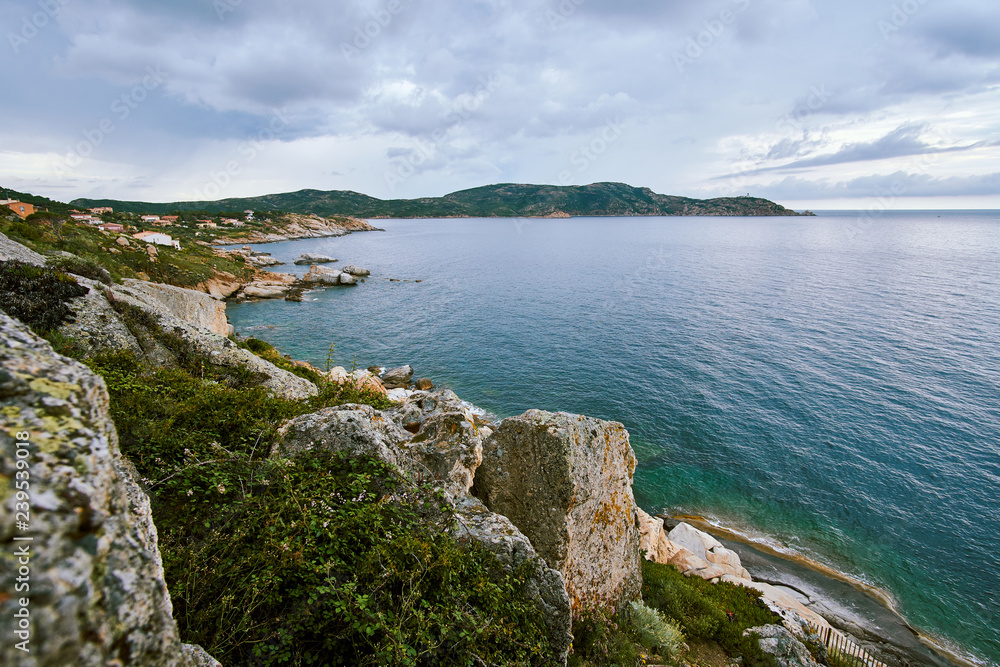 Wide coastline view of a bay from above aerial shot in Corsica, Corse