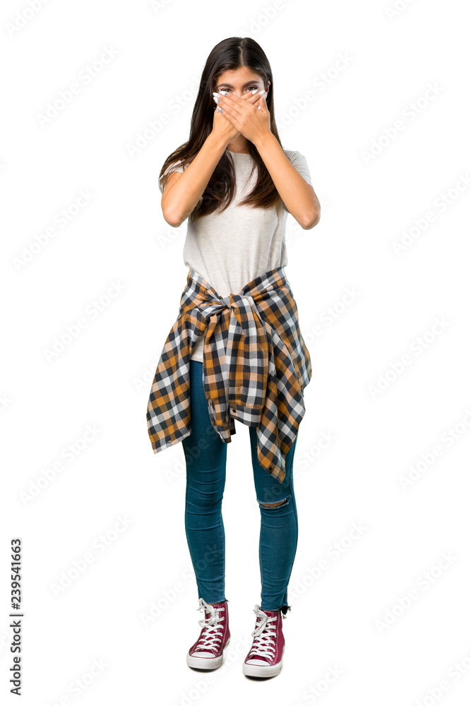 A full-length shot of a Teenager girl with shirt tied to the waist covering mouth with hands for saying something inappropriate A full-length shot of a Teenager girl with shirt tied to the waist covering mouth with hands for saying something inappropriate