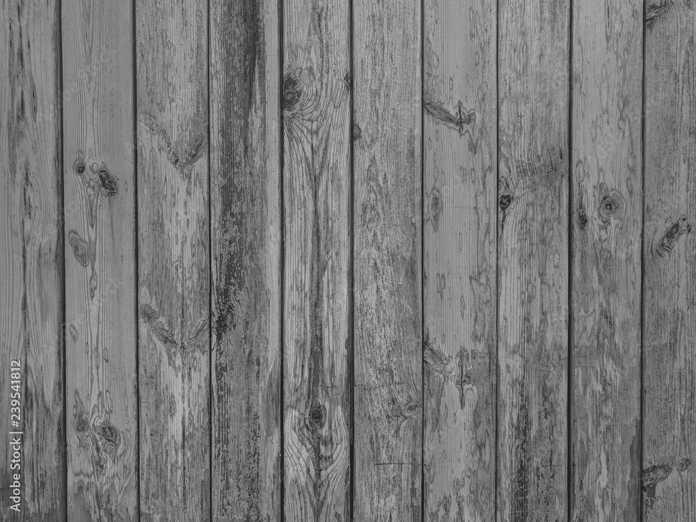 Fototapeta premium Old dark black and white vintage rustic aged antique wooden panel with vertical gaps, planks and chinks background texture