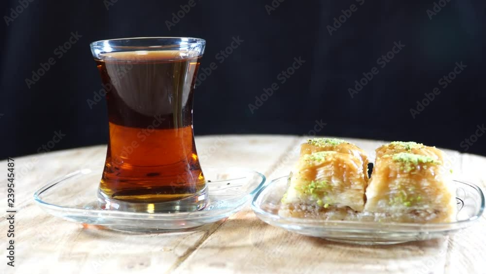 The legendary Turkish baklava and Turkish tea. Turkey cuisine. 4K The legendary Turkish baklava and Turkish tea. Turkey cuisine. 4K