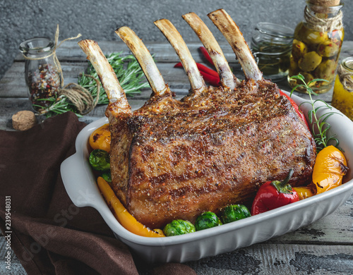 Принти на полотні Grilled roasted rack of veal lamb chops with vegetables in ceramic baking dish