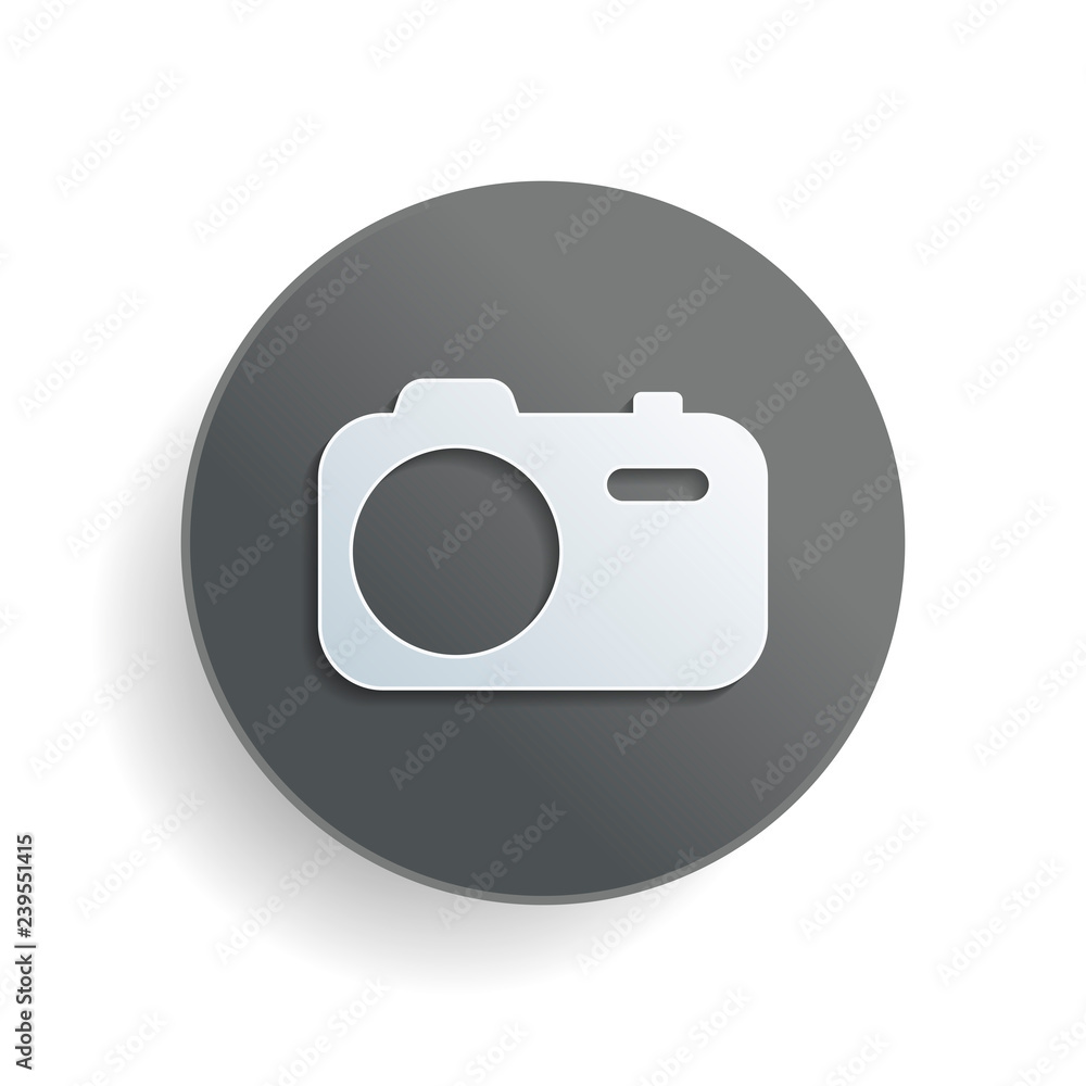 Simple photo camera. Technology icon. White paper symbol on gray round button or badge with shadow Simple photo camera. Technology icon. White paper symbol on gray round button or badge with shadow