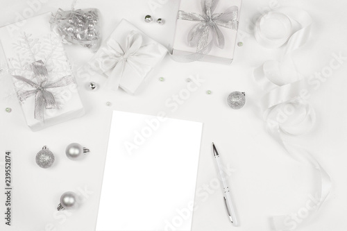 Three gift boxes and notebook on white background.