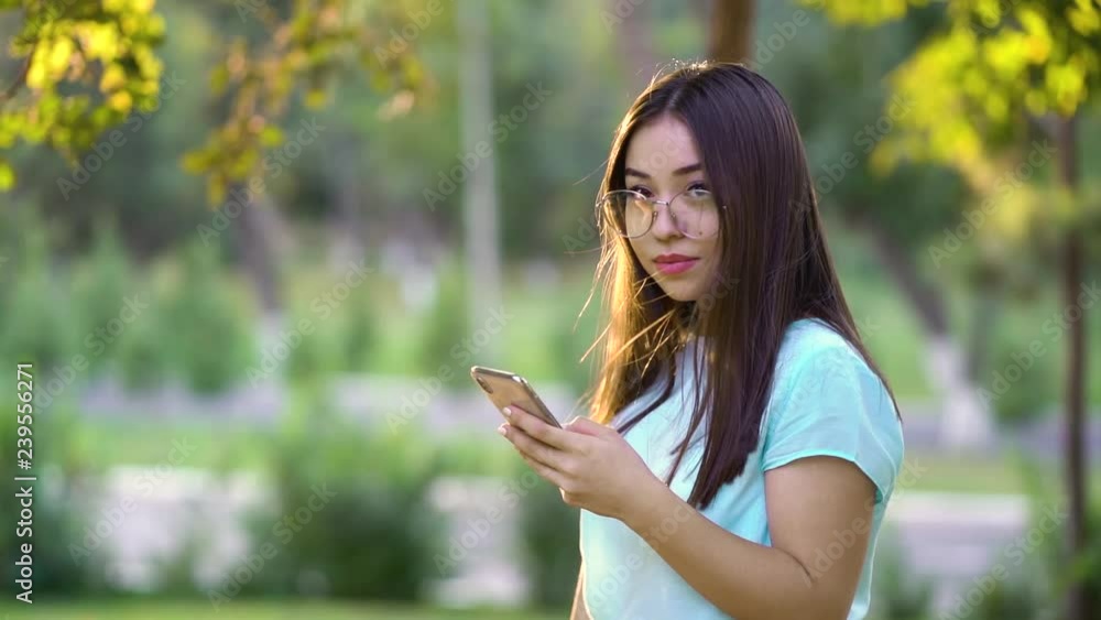 Beautiful millennial girl using wifi send email or sharing in social media or typing message on touch screen. Slow motion video Beautiful millennial girl using wifi send email or sharing in social media or typing message on touch screen. Slow motion video