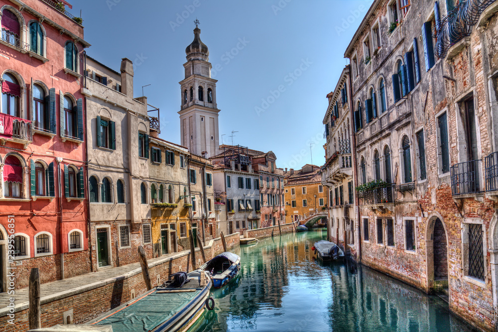 Canal and church tower in  Venice, Italy
