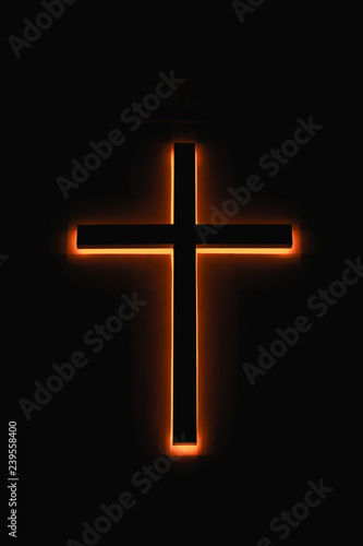 A led glowing church cross light in night