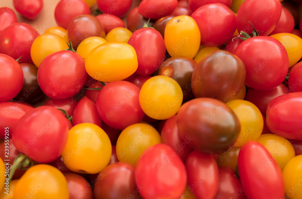 Assortment of different organics cherry tomatoes sold at Ljubljana central market. Slovenia Assortment of different organics cherry tomatoes sold at Ljubljana central market. Slovenia