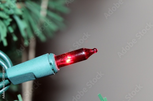 Red Christmas light isolated with copy space on right