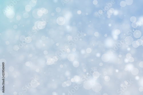 Shiny blue bokeh blur background. Glowing glitter circle particles holiday.