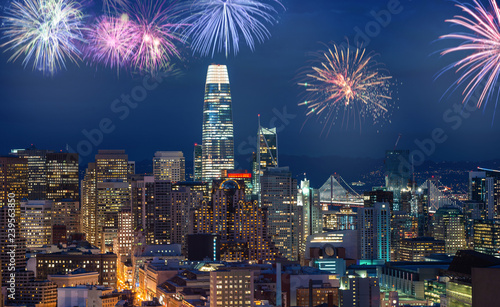 Downtown San Francisco cityscape with flashing fireworks Celebrating New Years Eve