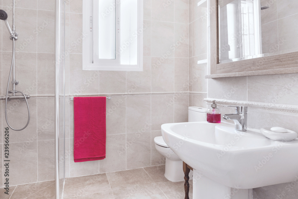 True real bathroom with toilet and sink with towels and purple soaps True real bathroom with toilet and sink with towels and purple soaps