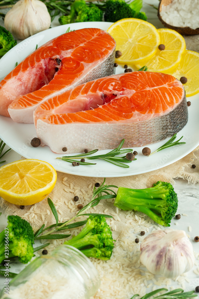 Delicious fresh fish steaks, salmon, trout. With vegetables, deli, vegan food, diet and Dotex Delicious fresh fish steaks, salmon, trout. With vegetables, deli, vegan food, diet and Dotex