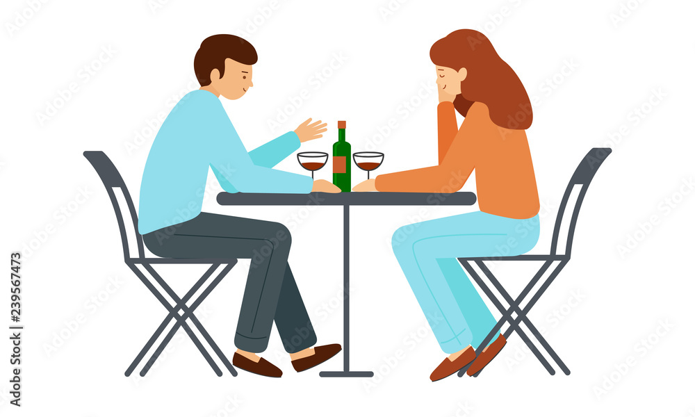 Man and woman sitting at a table. Guy and girl sitting opposite each other, on the table is a bottle of wine, glasses Man and woman sitting at a table. Guy and girl sitting opposite each other, on the table is a bottle of wine, glasses