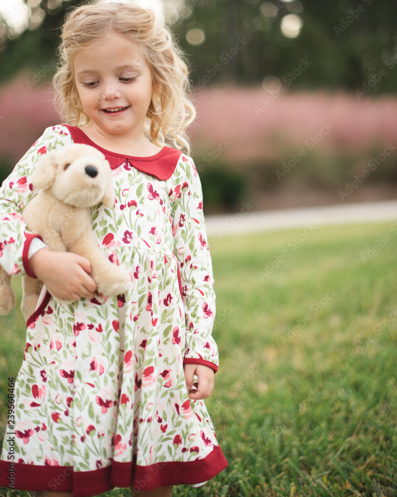 Young girl holding a stuffed animal Young girl holding a stuffed animal