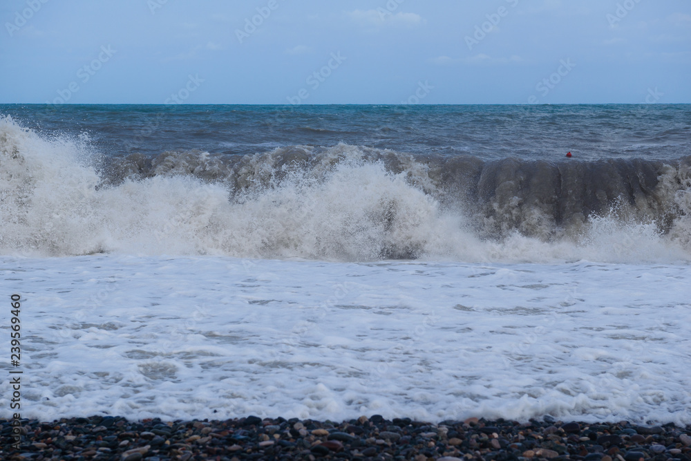 Stormy sea waves breaking near the coast Stormy sea waves breaking near the coast