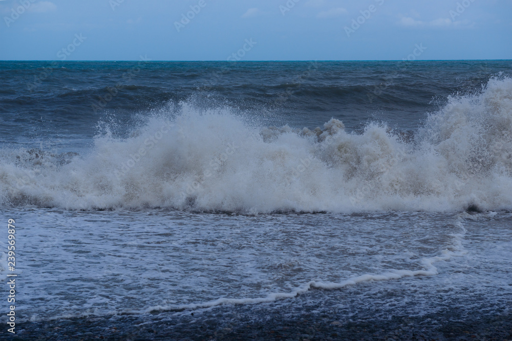 Stormy sea waves breaking near the coast Stormy sea waves breaking near the coast
