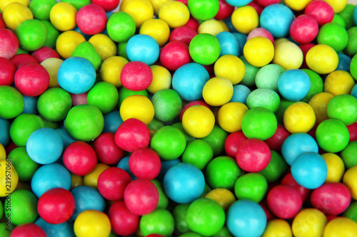 Multicolored chocolate dragee. Chocolate candy dragees covered colorful glaze