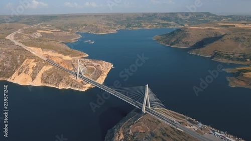 The Nissibi Euphrates Bridge is a cable-stayed bridge completed on May 21, 2015, spanning the Lake Ataturk Dam on the Euphrates River at the provincial border of Adiyaman – Sanliurfa. photo