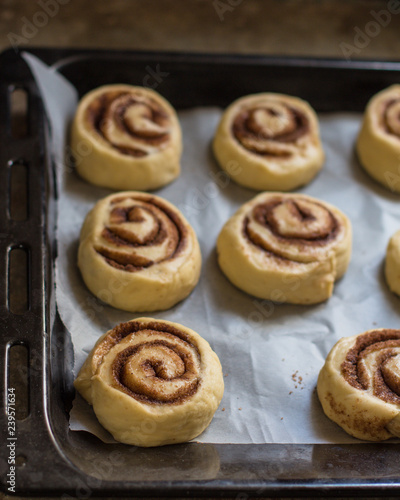 cinnamon buns - Cinnabon cooking process raw dough. (food background). copy space