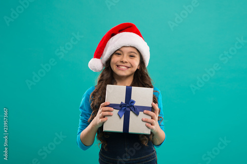 Happy winter holidays. Small girl. Little girl child in santa hat. New year party. Santa claus kid. Present for Xmas. Childhood. Christmas shopping. Christmas hope yours is all about the merry