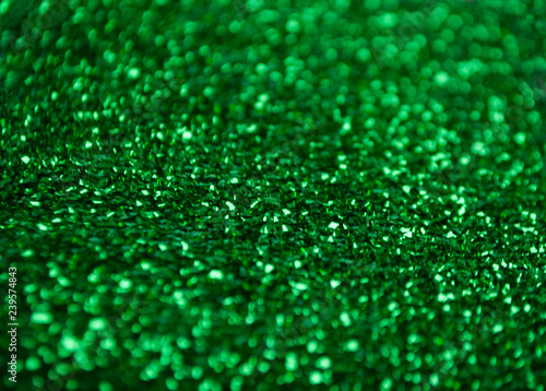 Green glittery shimmering background with blinking details.