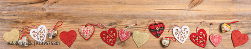 Top view, flat lay of various hearts, wooden background, banner.