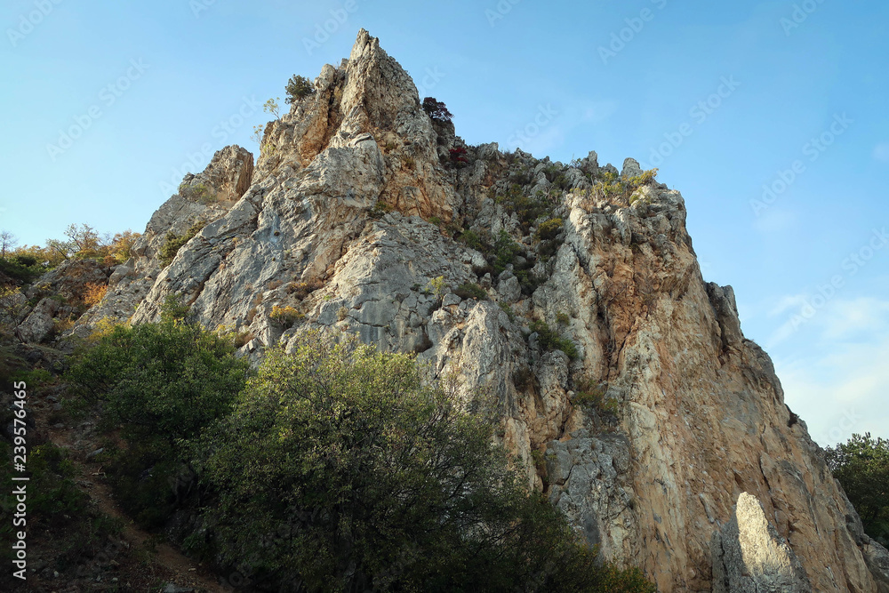 Scenic landscape of South Coast of Crimea with cliffs and autumn forest, Russia