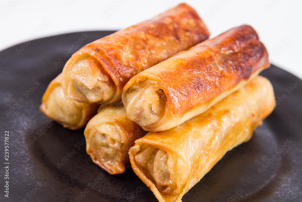 Chinese Traditional Spring roll with sweet and sour sauce eaten with a fork