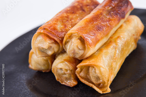 Chinese Traditional Spring roll with sweet and sour sauce eaten with a fork