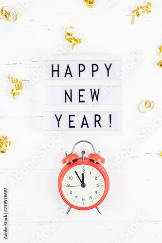 New Year composition alarm clock golden confetti