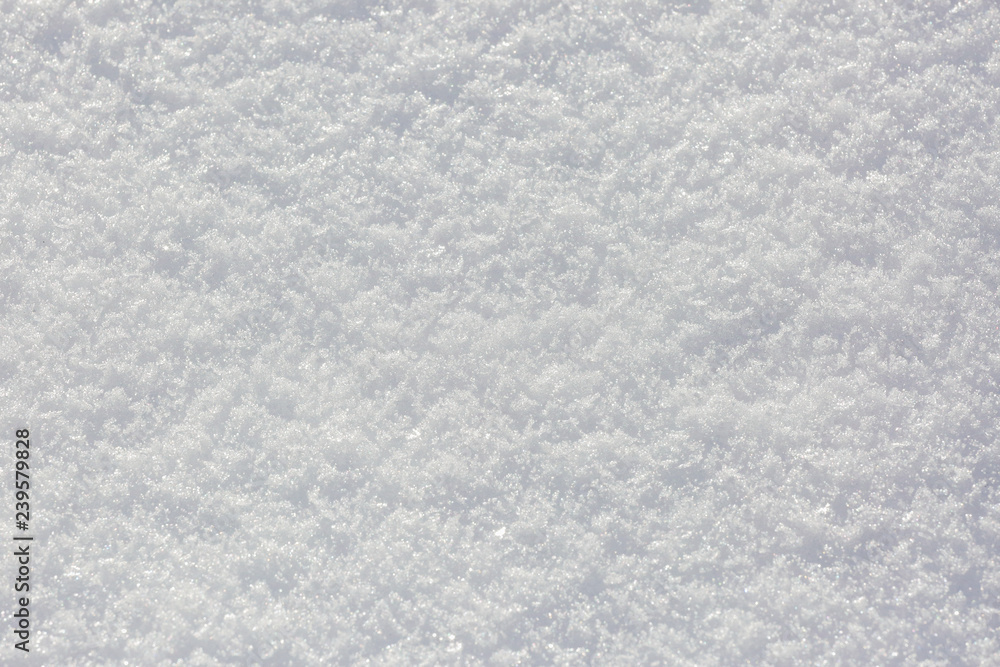 Snow texture and background in a sunny winter day