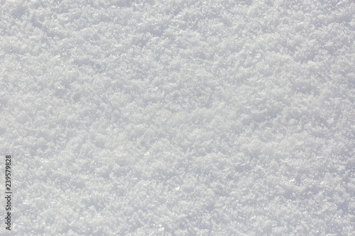 Snow texture and background in a sunny winter day