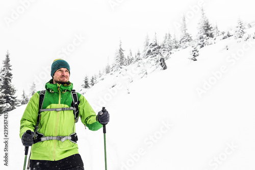 Winter hike in white, man and adventure concept