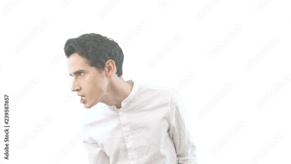 Young man on white background angry and upset, very tense, screaming furious, negative and crazy Young man on white background angry and upset, very tense, screaming furious, negative and crazy