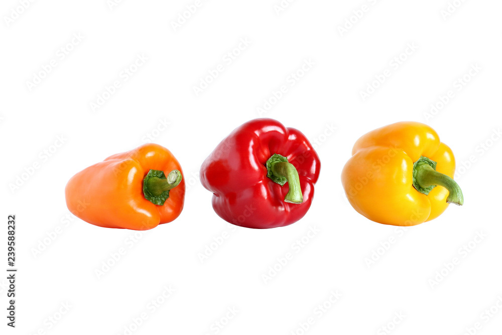 Orange, red and yellow sweet paprika isolated on white Orange, red and yellow sweet paprika isolated on white