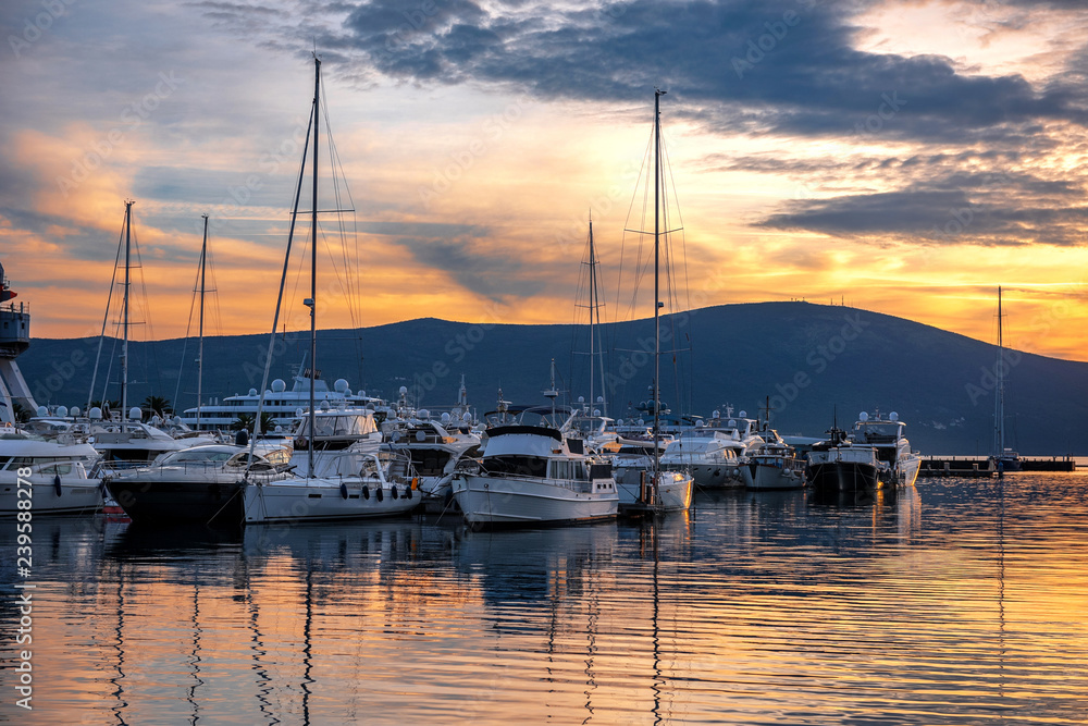 yachts in marina at sunset on the sea