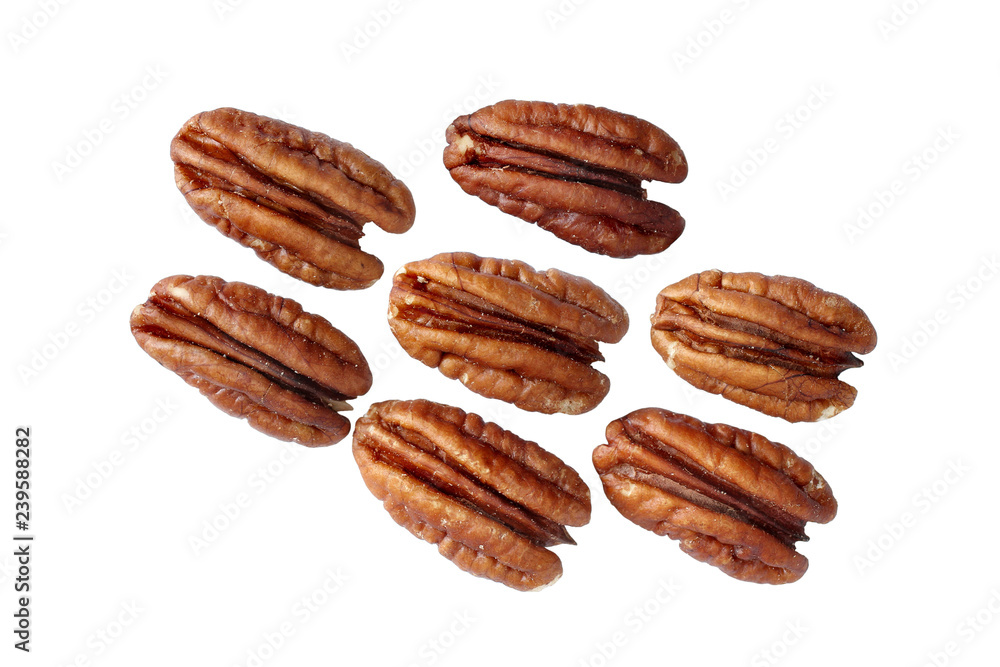 Seven shelled pecan nuts isolated on white background Seven shelled pecan nuts isolated on white background