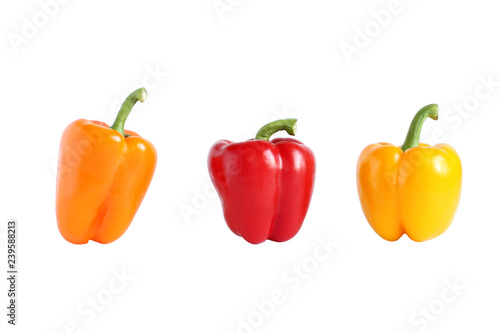 Orange, red and yellow sweet paprika isolated on white