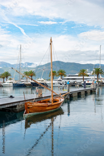 Wood boat in harbor in sea of Montenegro