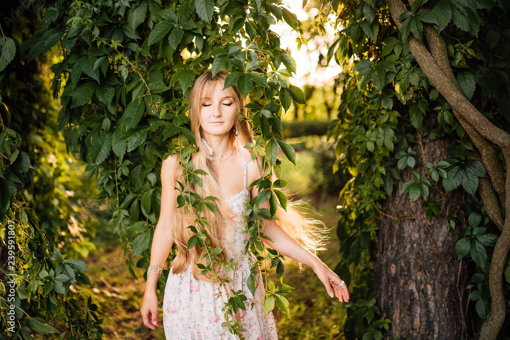 beautiful young girl in a white dress with long hair resting outdoors, amazing woman walking in the park beautiful young girl in a white dress with long hair resting outdoors, amazing woman walking in the park