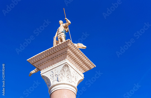 View of the Venetian statue of St. George and the dragon against the blue sky, Las Vegas, Nevada, USA. Isolated on blue background.