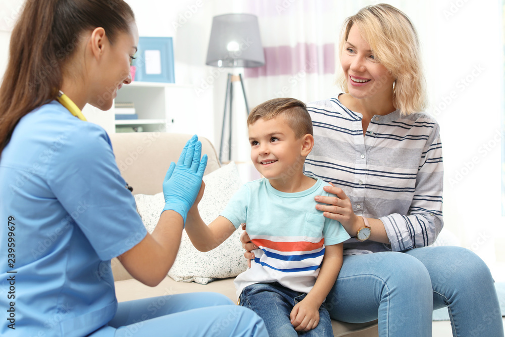 Children's doctor visiting little boy at home Children's doctor visiting little boy at home