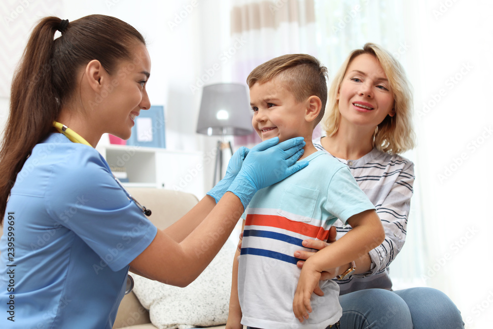 Children's doctor visiting little boy at home Children's doctor visiting little boy at home