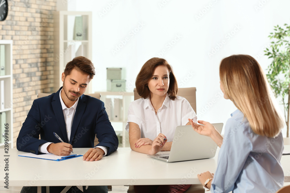 Human resources commission conducting job interview with applicant in office Human resources commission conducting job interview with applicant in office