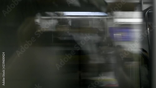 Blurred people and fast train passing by and traveling at high speed. Public transport concept.
