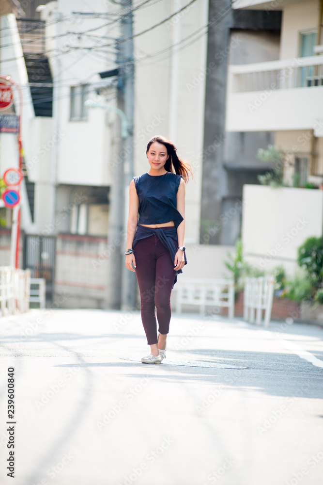 Asian female model poses for pictures on the street Asian female model poses for pictures on the street