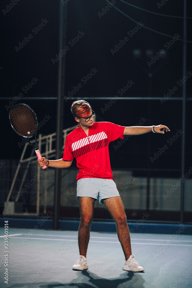 Guy posing on the tennis court